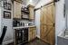 Sliding barn door leading to office space
