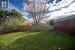 View of yard with a storage shed