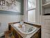 This antique tub was given a new look with a rustic slate surround