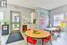 Dining room featuring light wood-type flooring and a wealth of natural light