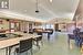 Dining area with a textured ceiling and vaulted ceiling