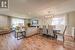 Living room with an inviting chandelier and light hardwood / wood-style floors