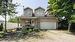 View of the house from the east side. Oversized garage and front addition completed in 2002-2005.