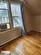 Additional living space featuring plenty of natural light, light wood-type flooring, and lofted ceiling