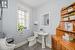 Bathroom with toilet and tile patterned flooring