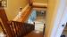 Beautiful wooden staircase leading to 3 large bedrooms on 2nd floor