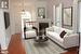 Living room featuring hardwood / wood-style flooring and an inviting chandelier