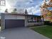 Single story home with a garage and covered porch