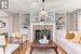 Living room featuring a fireplace, light hardwood