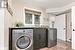 Laundry room featuring separate washer and dryer and cabinet with sink