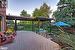 Deck featuring a gazebo covering hot tub