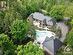 This aerial photo allows you to appreciate the beauty of this home and the property that surrounds it. The landscaping with tremendous easy to care for perennials including gorgeous Hostas and Gra