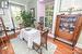 Cozy dining room with built in's on either side of the double sided Fireplace.