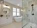 Primary ensuite with large stand up glass shower, soaker tub & separate sinks w/quartz