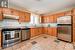 Large, functional kitchen with stainless steel appliances.