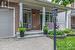 Beautiful interlock walkway leads to covered front porch.