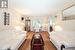 Living room with hardwood / wood-style floors and crown molding