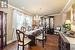 Dining room with ornamental molding, dark hardwood / wood-style flooring, and a notable chandelier