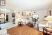 Living room with light hardwood / wood-style floors and crown molding