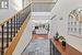 Foyer entrance featuring hardwood / wood-style flooring and a towering ceiling