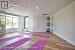 Exercise room featuring expansive windows and hardwood / wood-style floors