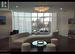 Living room with an inviting chandelier, a wealth of natural light, and expansive windows