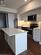 Kitchen with appliances with stainless steel finishes, dark hardwood / wood-style floors, a center island, and sink