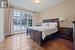 Bedroom featuring hardwood / wood-style flooring