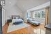 Bedroom with wood-type flooring and vaulted ceiling