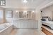 Bathroom with vanity and a relaxing tiled tub