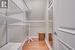 Spacious closet with hardwood / wood-style flooring