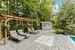 View of patio / terrace featuring a pergola and a storage unit