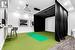 Playroom with golf simulator, a wall unit AC, and carpet