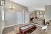 Living room featuring an inviting chandelier, vaulted ceiling, and light hardwood / wood-style flooring