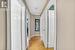 Corridor with light hardwood / wood-style flooring