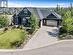 Exposed aggregate driveway and walks. Triple garage