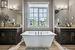 His & Her vanities with beautiful soaker tub