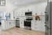 Beautiful kitchen with quartz counters and stainless steel appliances