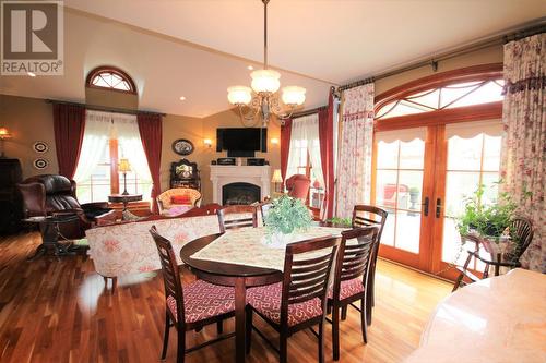 1829 86 Avenue, Dawson Creek, BC - Indoor Photo Showing Dining Room With Fireplace