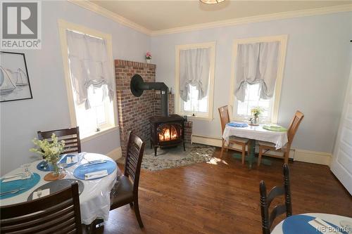 22 Route 776, Grand Manan, NB - Indoor Photo Showing Dining Room With Fireplace