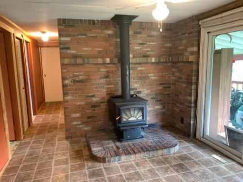 8412 Kaisner Road, Elk Valley, BC - Indoor Photo Showing Other Room With Fireplace