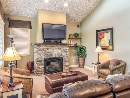 334 - 300 Bighorn Boulevard, Radium Hot Springs, BC - Indoor Photo Showing Living Room With Fireplace
