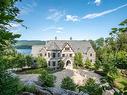 Back facade - 730 Ch. Thomas-Robert, Lac-Tremblant-Nord, QC  - Outdoor With Body Of Water With View 