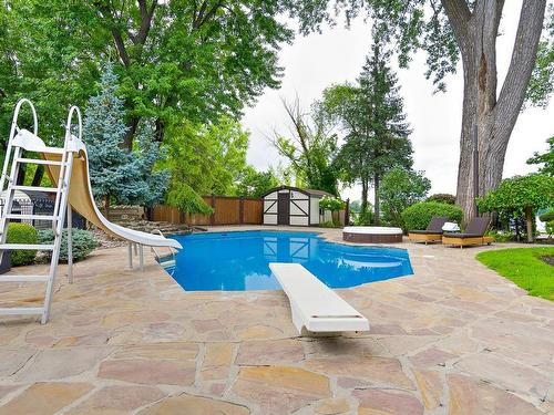 Pool - 201 Rue Saraguay E., Montréal (Pierrefonds-Roxboro), QC - Outdoor With In Ground Pool