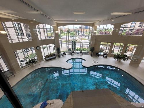 Piscine - 851-11 Place De La Triade, Pointe-Claire, QC - Indoor Photo Showing Other Room With In Ground Pool