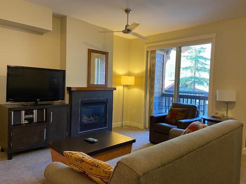 214D - 2049 Summit Drive, Panorama, BC - Indoor Photo Showing Living Room With Fireplace
