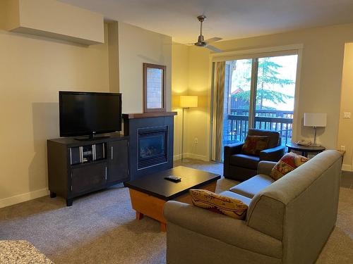 214D - 2049 Summit Drive, Panorama, BC - Indoor Photo Showing Living Room With Fireplace