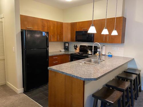 214D - 2049 Summit Drive, Panorama, BC - Indoor Photo Showing Kitchen With Double Sink