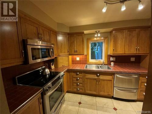 58 St-Georges Avenue, Edmundston, NB - Indoor Photo Showing Kitchen With Double Sink