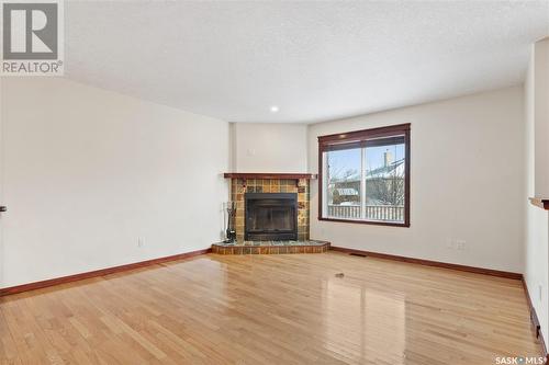8018 Sherwood Place, Regina, SK - Indoor Photo Showing Living Room With Fireplace